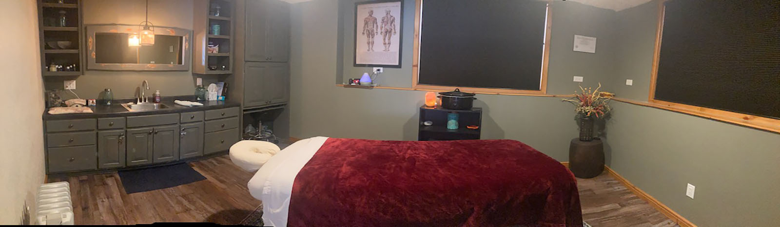 panoramic picture of cozy massage room